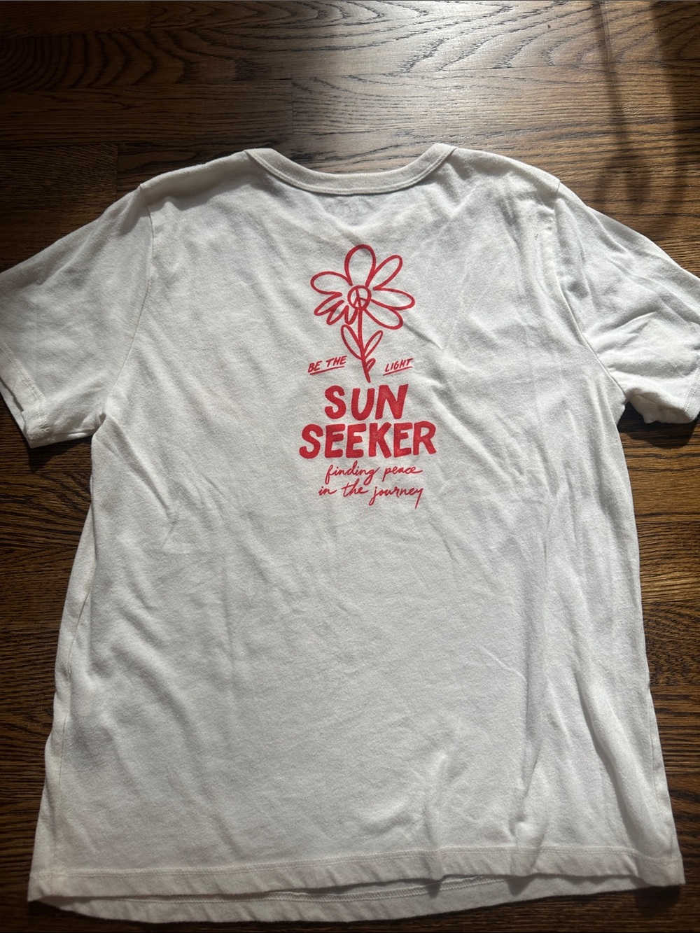 Unisex Sun Seeker White Graphic Tee - Red Print
Note: never worn